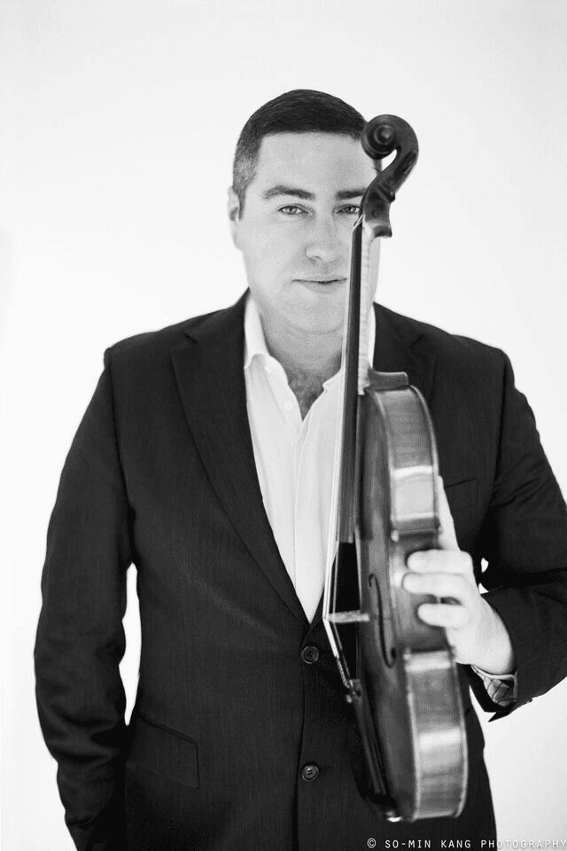Black and white photo of Michael Klotz with viola