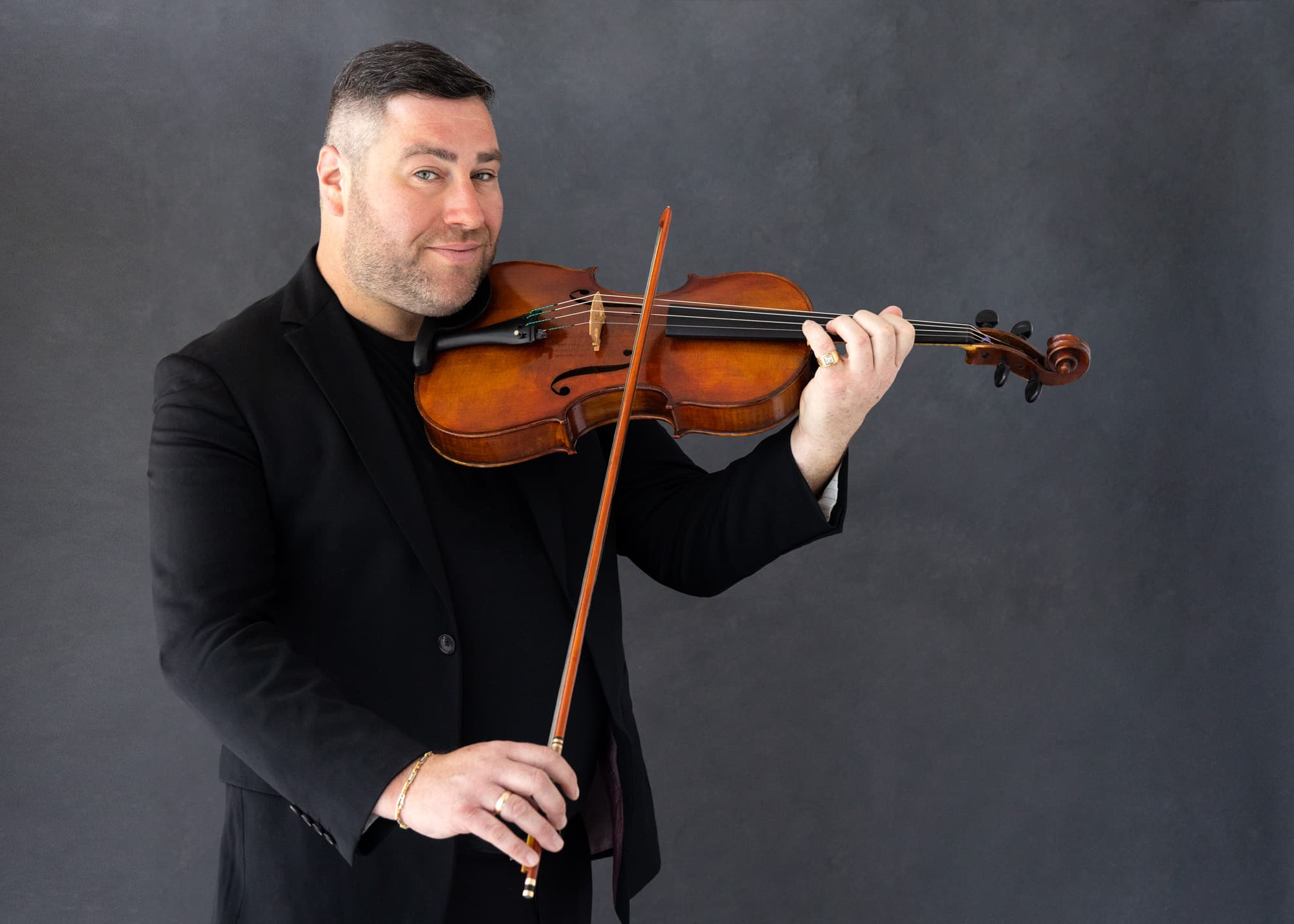 Photo of Michael playing his instrument